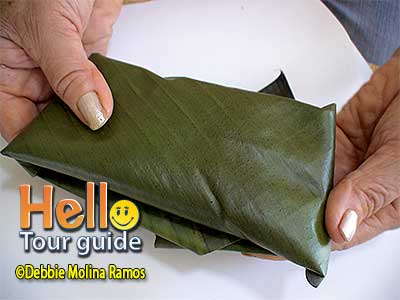 pastel wrapped in banana leaf
